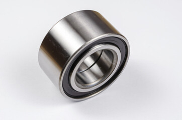 Auto parts, consumables.  Hub bearing on white background. New Silver front hub bearing of the car.