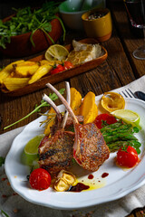 Lamb chops marinated in herbs with green asparagus and lime