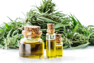 Cannabis seeds and hemp oil isolated on white background. Close up.