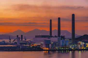 Power plant in Hong Kong city under sunset