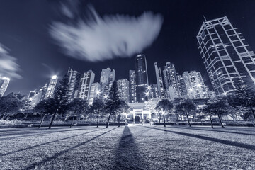 High rise office building and public park in downtown of Hong Kong city at night