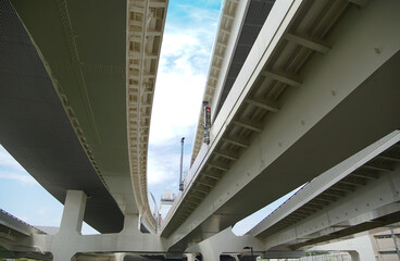 Naklejka premium Steel structure viaduct of a highway on a sunny blue sky day