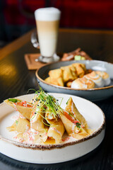 Fresh salmon and cream cheese crepes and french style sweet crepes with soft cream