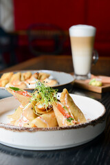 Fresh salmon and cream cheese crepes and french style sweet crepes with soft cream