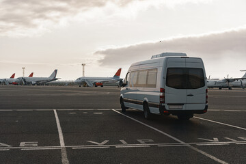 Fototapeta na wymiar Minibus on a parking lot in airport