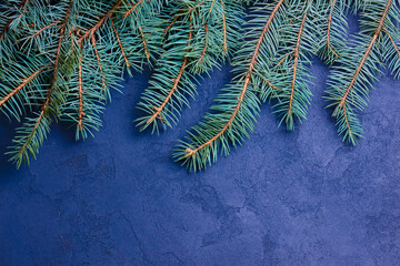 Flay lay Christmas greeting card. Christmas tree over blue background.