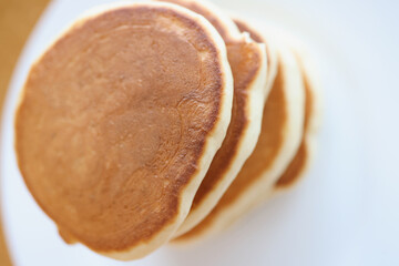 Flour toasted pancakes on white plate closeup