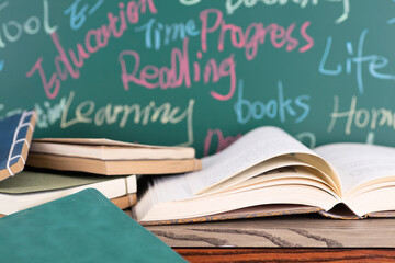 Books in front of the blackboard
