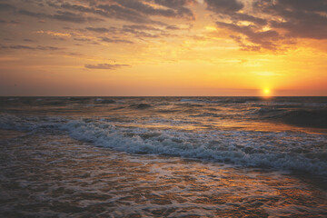 Seascape in the evening. Golden sunset over the sea