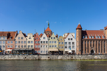 Fototapeta na wymiar Gdansk, Old Town - historic tenement houses with gables on the banks of the River Motlawa, Poland