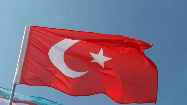Turkey. National country flag on blue sky background. Flying fabric symbol. Tourism or travel summer day. international patriotic emblem. Nobody. Horizontal video