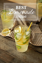 Glass of tasty cold lemonade on wooden background