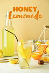 Glass of tasty cold lemonade on table