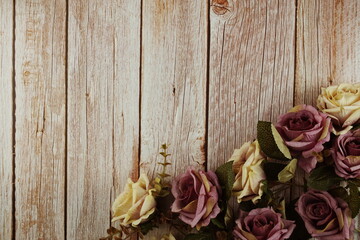 Roses flower bouquet with space copy on wooden background