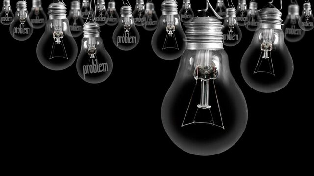Light bulbs going from dark to light with Problem and Solution fiber text on black background. High quality 4k video