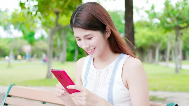 woman use smartphone in park