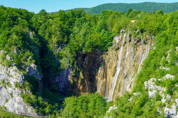 Fototapeta na wymiar View of mighty crystal clear waterfalls at Plitvice lakes National park, Croatia 