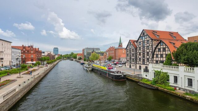 Bydgoszcz, Poland. Time lapse view of old town from bridge over Brda river
