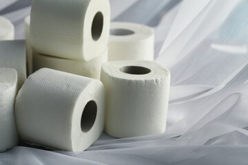 Toilet paper in a roll. Snow-white soft three-layer toilet paper. Lack of hygiene products. Primary protection and disinfection.