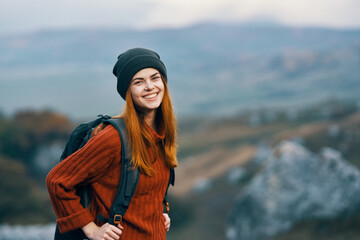 Cheerful female tourist backpack nature mountains landscape travel