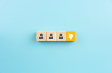 Yellow wooden blocks with light bulb icon and Businessman icons, Brainstorming, innovation and...