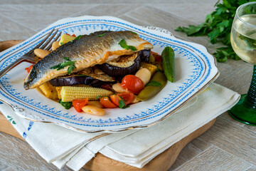 Sea bass with tomato and butter bean ragout