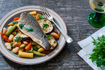 Sea bass with tomato and butter bean ragout