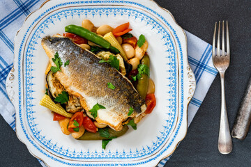 Sea bass with tomato and butter bean ragout