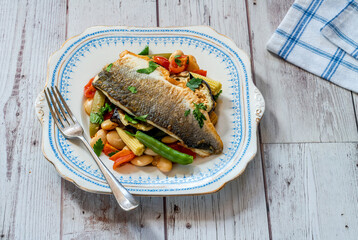 Sea bass with tomato and butter bean ragout