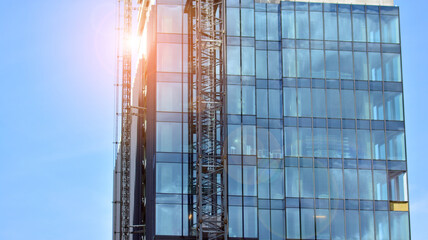 High-rise building under construction. Modern office building. Sunrise.