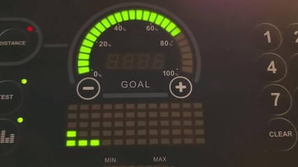 Closeup treadmill dashboard with blinking data. Cardio program start. Running track workout at home. Control panel display of fitness equipment for sport training