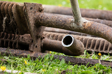 Rusty pipes and heating radiators. Metal collection and distribution area