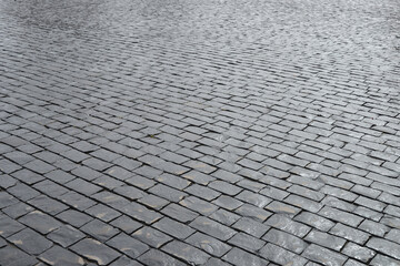 Old cobblestone pavement closeup.