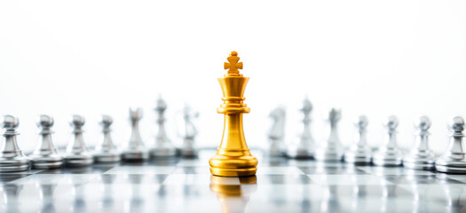 Concept of leadership. Golden king chess on the board.