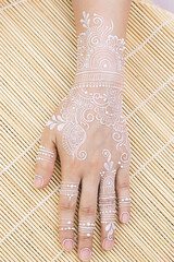 white henna on bride hand
