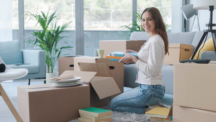 Woman unpacking in her new house