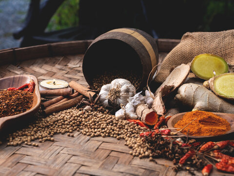 Top view of colourful spices in wooden tray. Asian popular cooking ingredients, dry hot healthy cook herbs. view form above and copy space background.