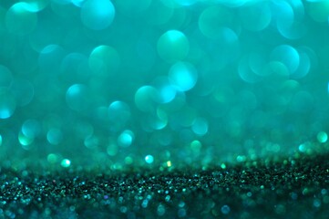 Abstract turquoise color bokeh glitter light blur background