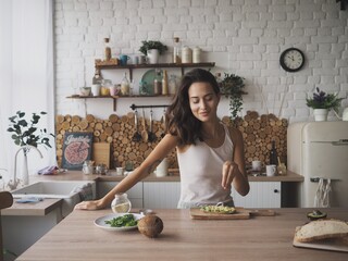 young woman preparing breakfast in the kitchen