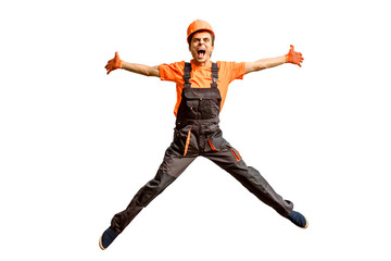 Young happy laughing caucasian man builder construction worker in a safety helmet is jumping in...