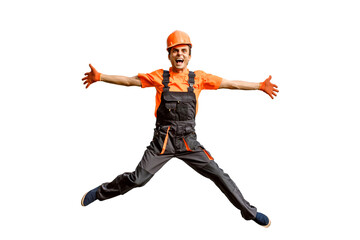 Young happy laughing caucasian man builder construction worker in a safety helmet is jumping on white background isolated.