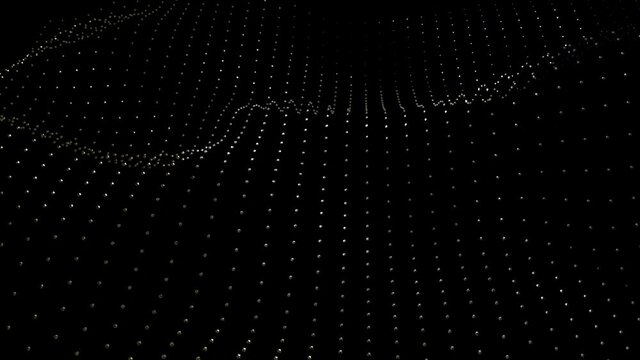 A moving abstract grid whose nodes are metal polyhedron over black background.
Technology or science. 3d rendering, seamless, loopable.      