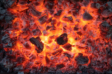 Obraz premium burning coals background. burning charcoal. The fire for the kebab is in a state of embers.
