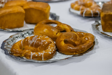 Freshly baked pretzels, kringles on plate at cuisine of cafe, restaurant or bakery. Pastry, pastry, bakery, culinary, gastronomy and food concept