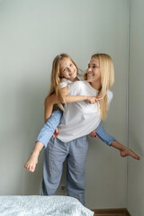 Mom with little girl have a fun.