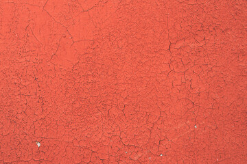 Dyed And Cracked Flaked Texture Of Red Paint At Wall Surface