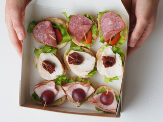 close up sandwiches in cardboard packaging in portions in catering services delivery