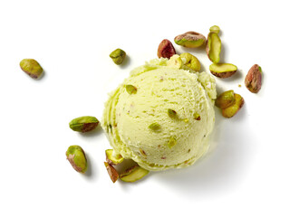 Scoop of pistachio ice cream with pistachio nuts on white background. Top view of ice cream...