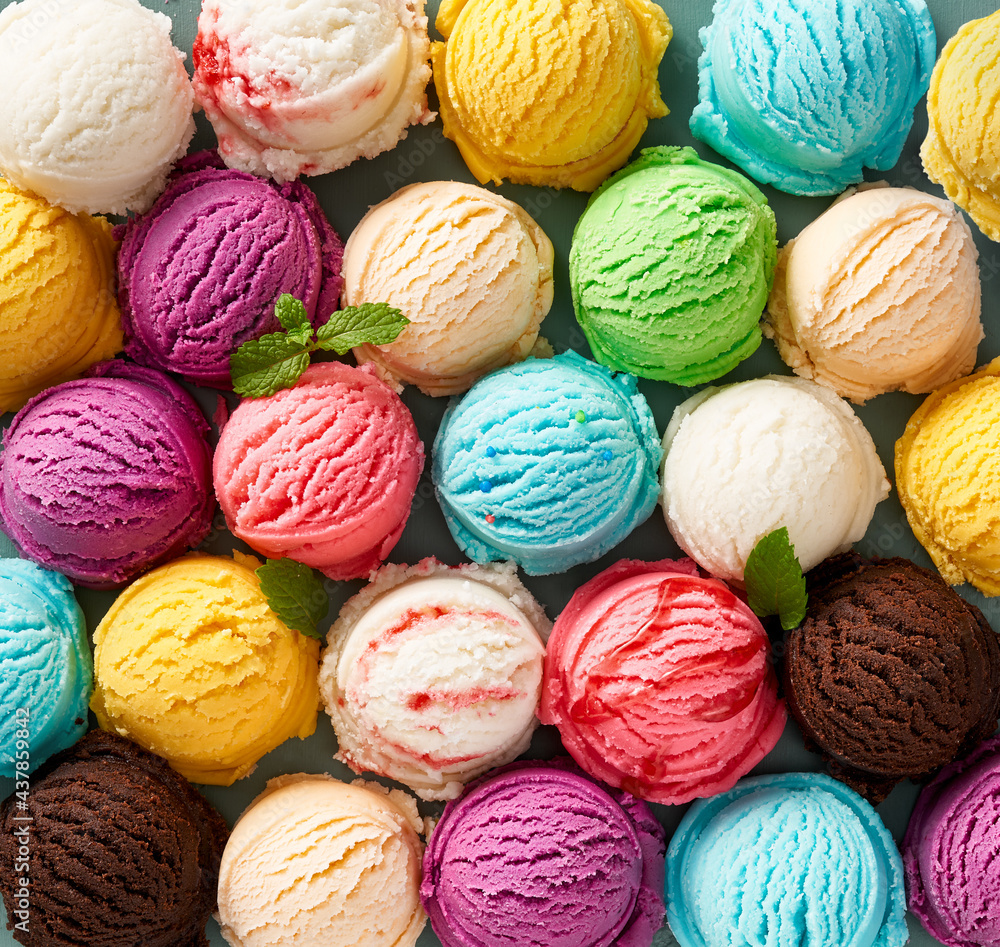 Fototapete Assorted of scoops ice cream. Colorful set of ice cream of different flavours. Top view of ice cream isolated with mint, sauce