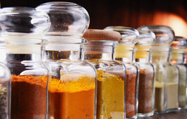 Glass storage jars with spices and herbs